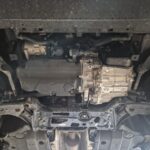 Audi A3 underside before aluminum underbody protection installation with side brackets fitted