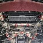 Alfa Romeo Stelvio underside before installation with mounting points marked