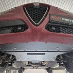 Front low-angle underside view of Alfa Romeo Stelvio with full steel underbody protection installed