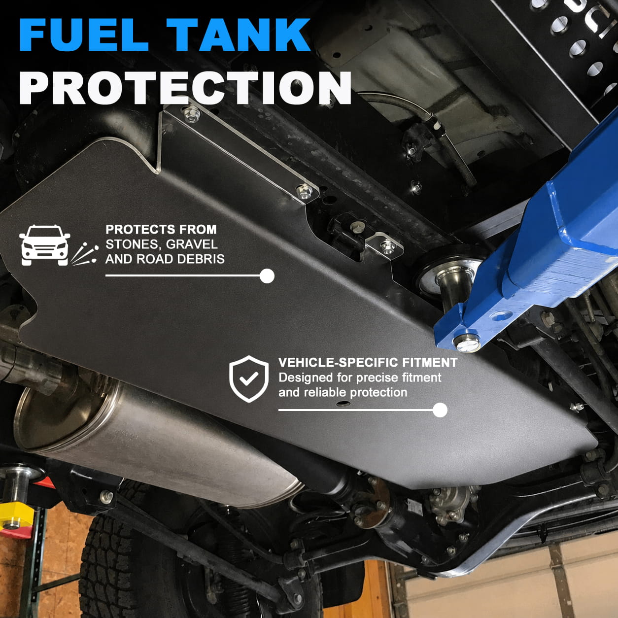 Rear fuel tank skid plate under an SUV protecting the tank area from rocks, gravel and winter road impacts
